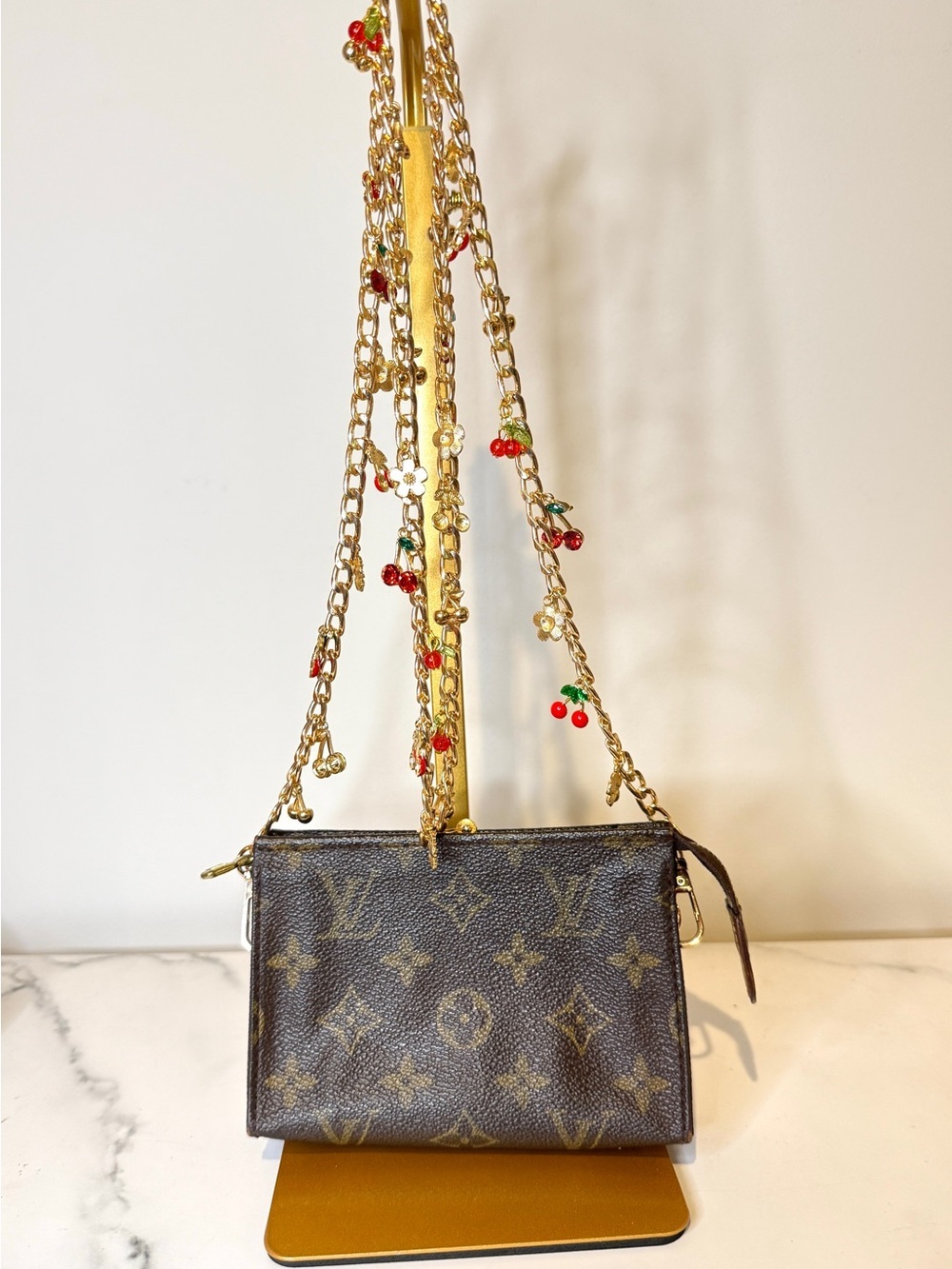 Louis Vuitton pouch with cherry themed crossbody